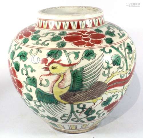 A Chinese polychrome jar decorated a bird amongst foliage