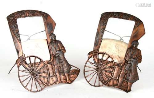 A pair of Japanese antimony picture frames in the form of a rickshaw, overall 26.5cms (10.5ins)