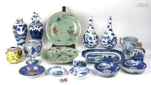 A pair of Chinese blue and white bottle vases decorated dragons chasing a flaming pearl with four