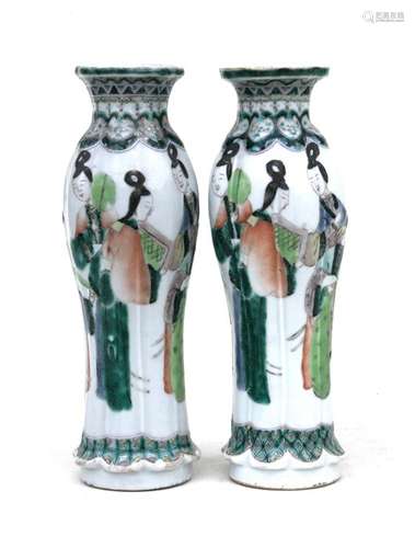 A pair of Chinese famille verte vases decorated with figures, four character mark to underside,