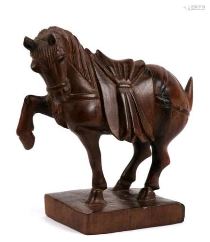 A Chinese hardwood carved tang style horse with glass eyes, 11cms (4.75ins) high.