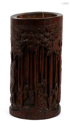 A Chinese bamboo brush pot decorated with figures amongst bamboo, 21cms (8.25ins) high.