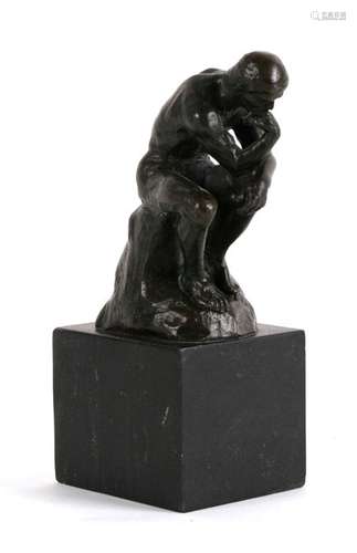 After Auguste Rodin (French 1840-1917) a bronze model - The Thinker - mounted on a black marble