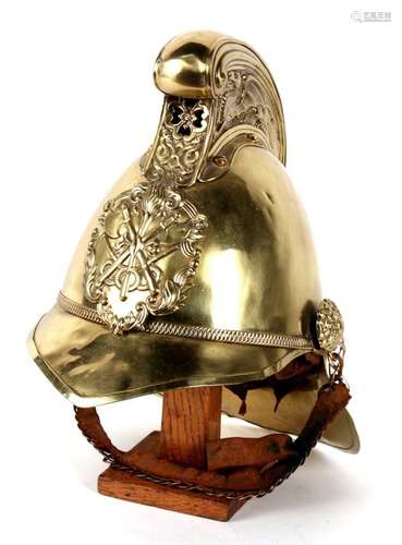 A late 19th / early 20th century Merryweather style fireman's helmet, the high comb with dragon