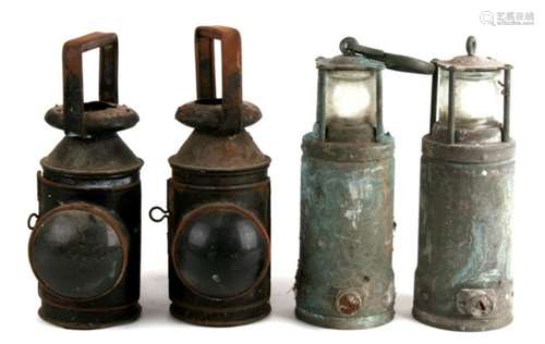 A pair of railway lamps with bulls eye lenses; together with a pair of miners lamps (4).