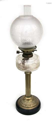 A Victorian oil lamp with etched glass shade and cut glass reservoir, on a brass Corinthian