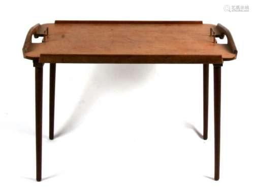 A Norwegian Aase Mobler mid-20th century tray table with folding legs, 68cms (26.75ins) wide.