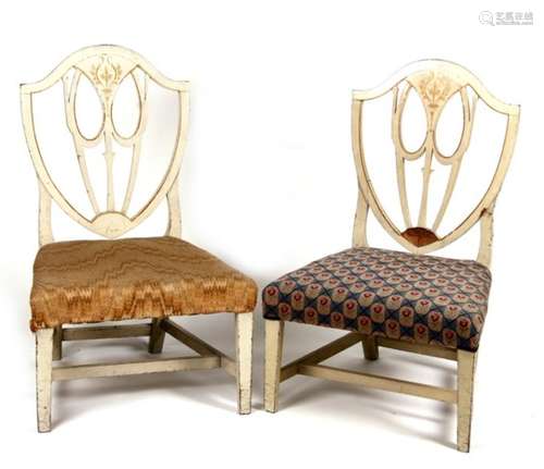 A pair of painted shield back period low chairs with upholstered seats (2).