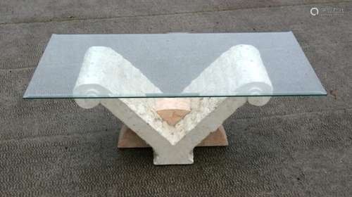 A modern design coffee table, the rectangular glass top on a faux marble stand, 120cms (47.25ins)