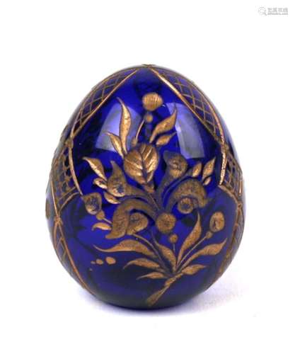 A Russian blue glass egg with engraved and gilded decoration, Faberge paper label to the