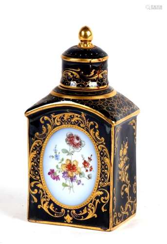 A Dresden porcelain tea caddy decorated with flowers within oval panels with gilt highlights, on a