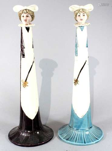 A pair of secessionist Art Nouveau tubelined candlesticks in the form of housemaids, possibly