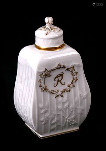 A KPM Blanc De Chine and gilt tea canister, moulded with trailing flowers and vines on a simulated