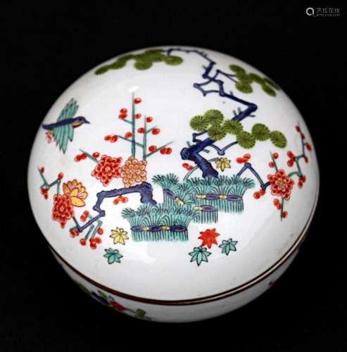 A Meissen Japanese pattern round box, blue crossed swords mark and red pattern number to base,