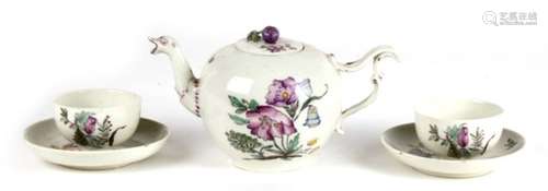 An 18th century Swiss teapot, together with two tea bowls and saucers, made by the Zurich