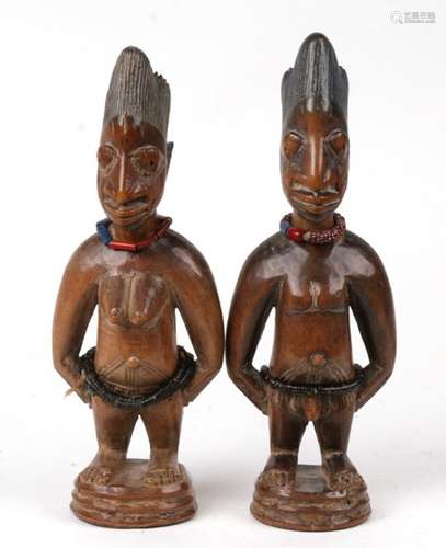 Africa/ Tribal Art. A pair of Nigerian Yoruba male and female Ibeji twin figures with strings of