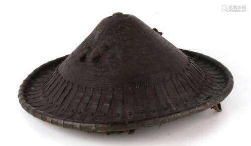 Tribal Art: an Ethiopian hide shield of conical form, decorated with metal strapwork to the edge.