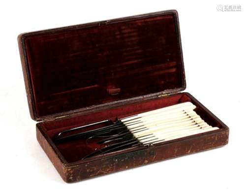 An early 19th century leather cased surgeon's kit containing twelve implements including scalpel and