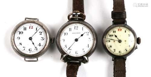 A group of three trench watches