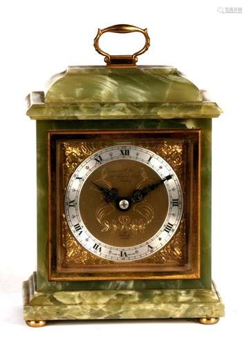 An Elliot mantle clock made for Garrard & Co., the silver chapter ring with Roman numerals, in a