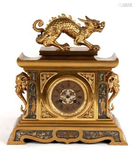 A 19th century gilded bronze mantle clock, the dial with Roman numerals, the case with inset mixed