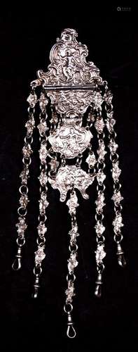 A Victorian silver chatelaine with four sections, one hinged, showing Britannia, a seated