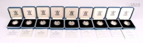 Nine cased proof silver one pound coins with certificate of authenticity, 1991 to 1999.