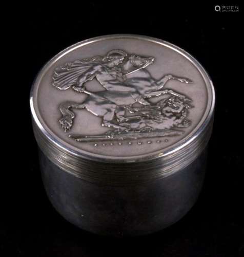 A heavy silver box produced by The Royal Mint, designed by Christopher Lawrence depicting St