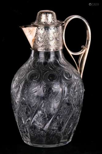 A 19th century ovoid glass decanter with silver plated mounts by Elkington, swirl and leaf