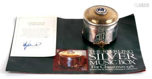 A limited edition 1981 silver music box by the St James House company, playing ‘Silent Night’.