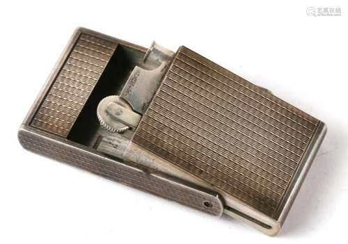 An Asprey silver Art Deco concealed cigarette lighter, London 1946.