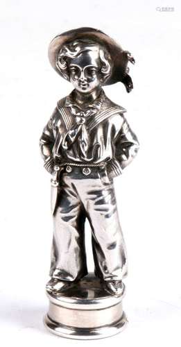 A silver desk seal cast in the form of a boy in naval uniform with agate matrix, London 1852 and