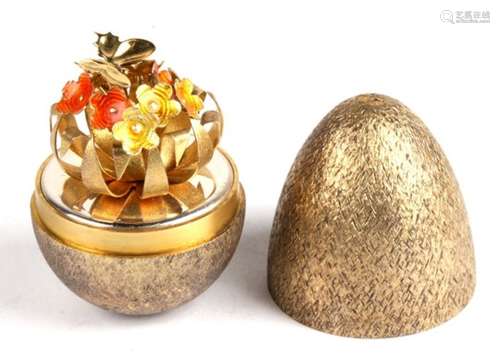 A Stuart Devlin silver and enamel surprise egg, opening to reveal a butterfly upon flowers, London