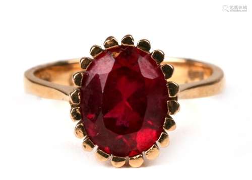 An 18ct gold ring set with a large oval ruby, approx UK size 'M'.