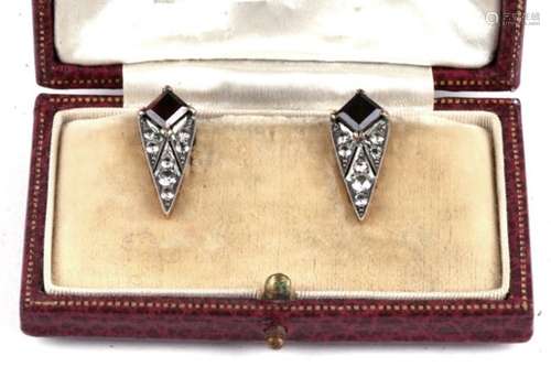 A pair of Art Deco yellow metal white sapphire and garnet clip on earrings, 2cms (0.75ins) high.