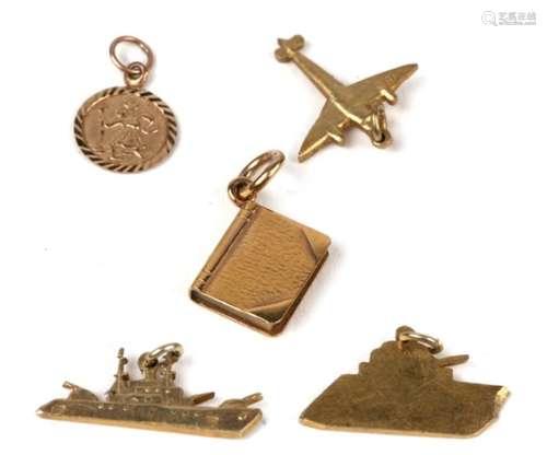 Three WWII Egyptian gold charms in the form of a tank, a ship and a plane; together with two other