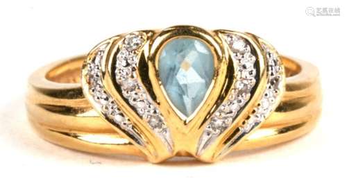 An 18ct gold diamond and aqua marine set ring. Approx. UK size O