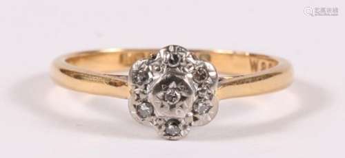 An 18ct gold diamond cluster ring, Approx. UK size 'M'. 2.8g