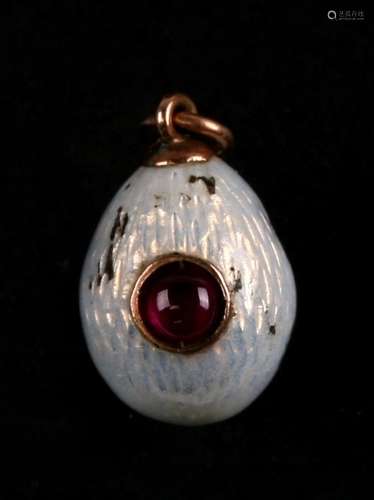 Alexander Wakeva, Faberge Workmaster, a gold mounted and ruby cabochon set enamel egg pendant, '