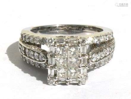 A 14ct white gold diamond ring, 2ct of square, round and baguette cut diamonds. Approx. UK size '