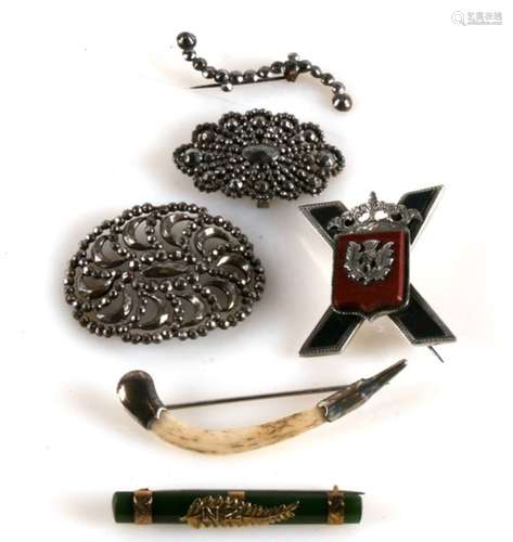 A Scottish hardstone set brooch; together with a 9ct gold mounted jade bar brooch; and other items.