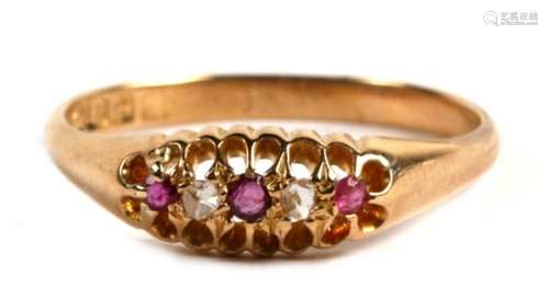 An 18ct gold, ruby and old cut diamond five stone ring, Birmingham 1911, 3.6g. Approx. UK size U.