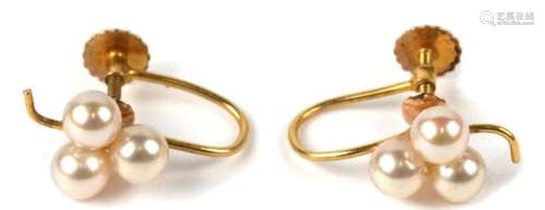 A pair of 9ct gold screw fit earrings set with three pearls, 1.5g