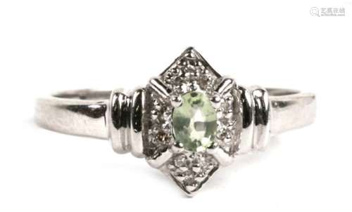 A 9ct white gold Art Deco style diamond and peridot ring, 2.5g. Approx. UK size N.