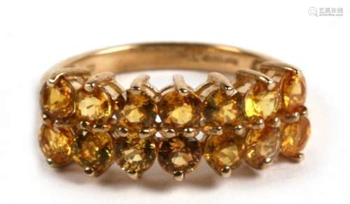 A 9ct gold and fourteen stone citrine double row ring, 3.3g. Approx. UK size N.