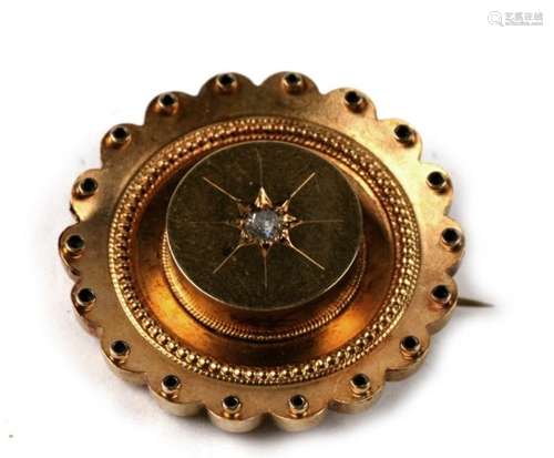 A late 19th century 15ct gold diamond set target brooch with glazed back, 6.7g. 3cm (1.2 ins)