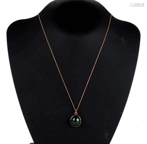 A 9ct gold oval pendant set with a large bloodstone cabochon with a yellow metal chain. Pendant 8.