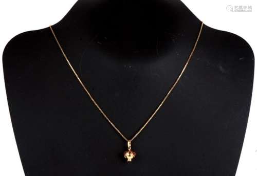 An 18ct gold Sputnik style pendant set with six cabochon orange stones, 1.5g, on 9ct gold chain, 2.