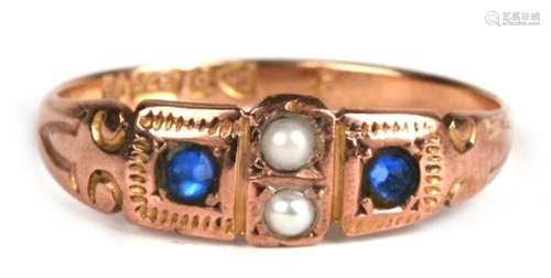 An Edwardian 9ct rose gold gypsy style ring set with two sapphires and two pearls, approx UK size '