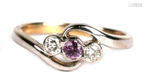 A 9ct white gold ring set with a central pink tourmaline flanked by two diamonds, approx UK size '